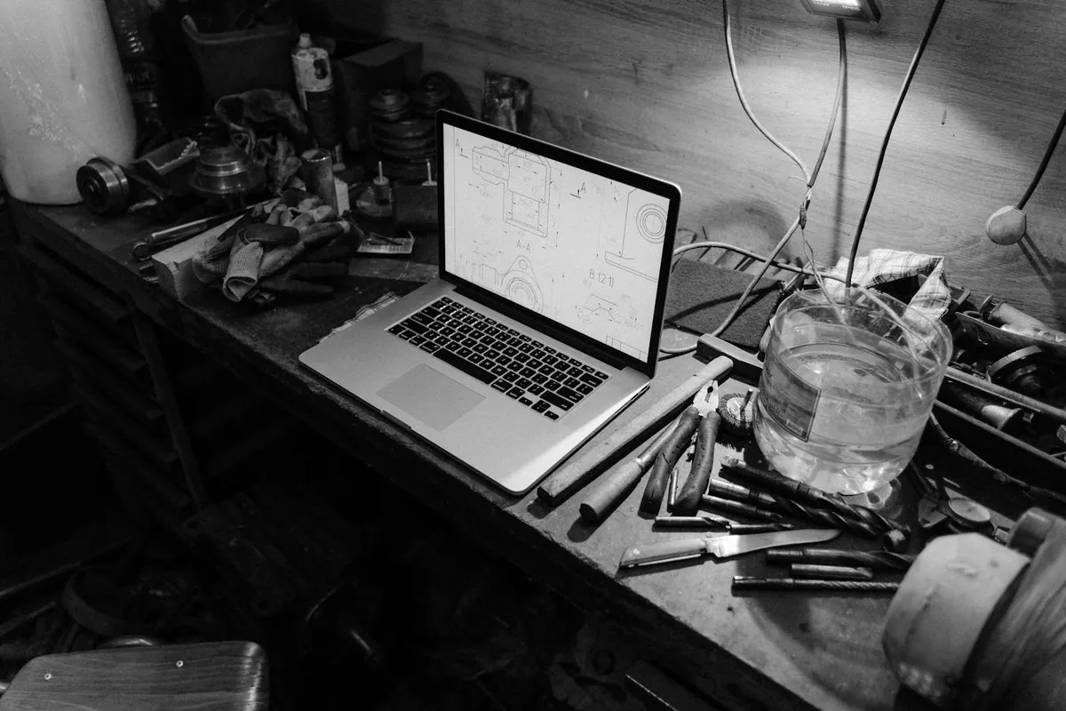laptop on workbench being repaired